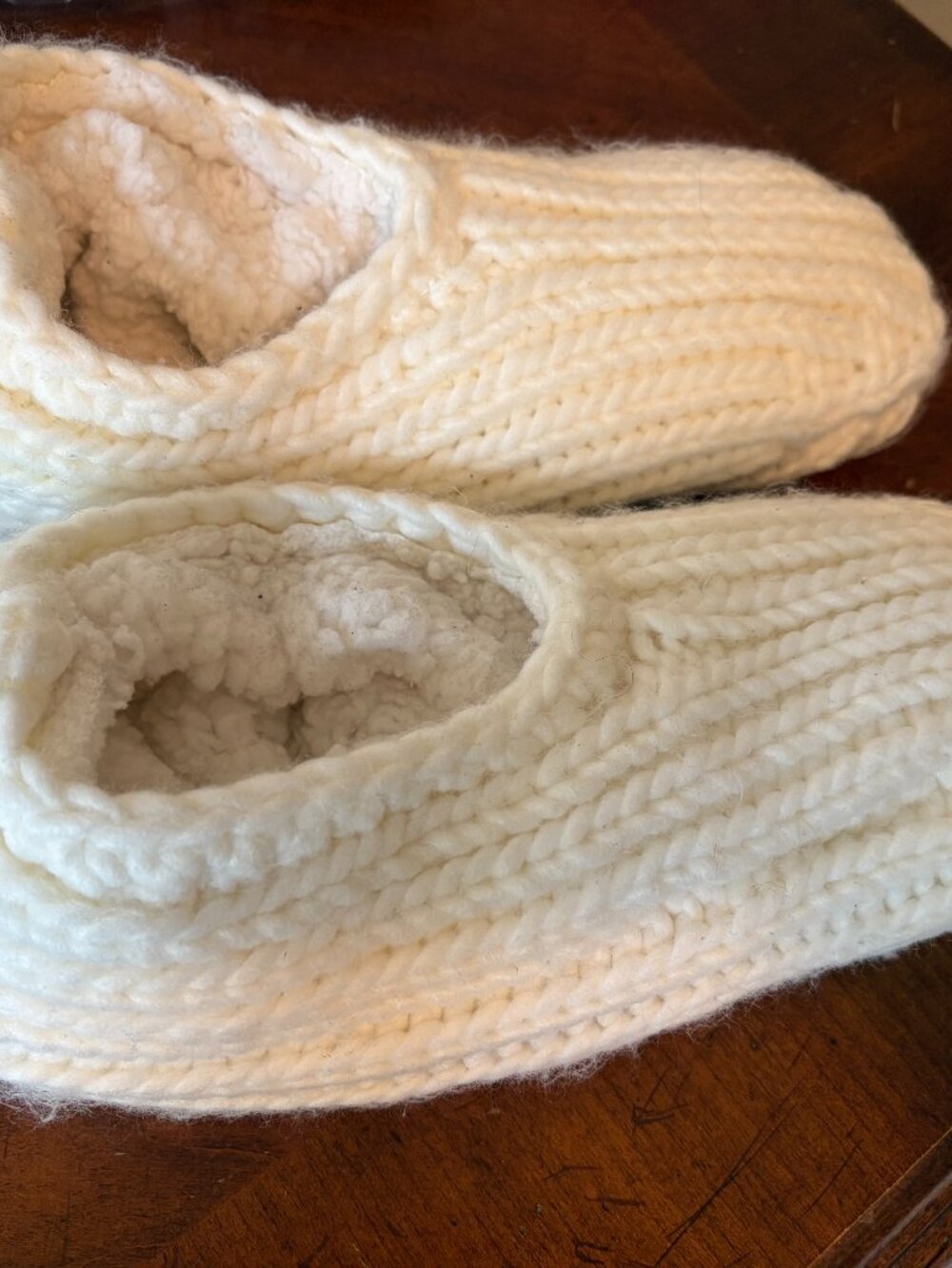 New with tags: Knitted cream-colored cozy sock slippers. Adorable and comfy!